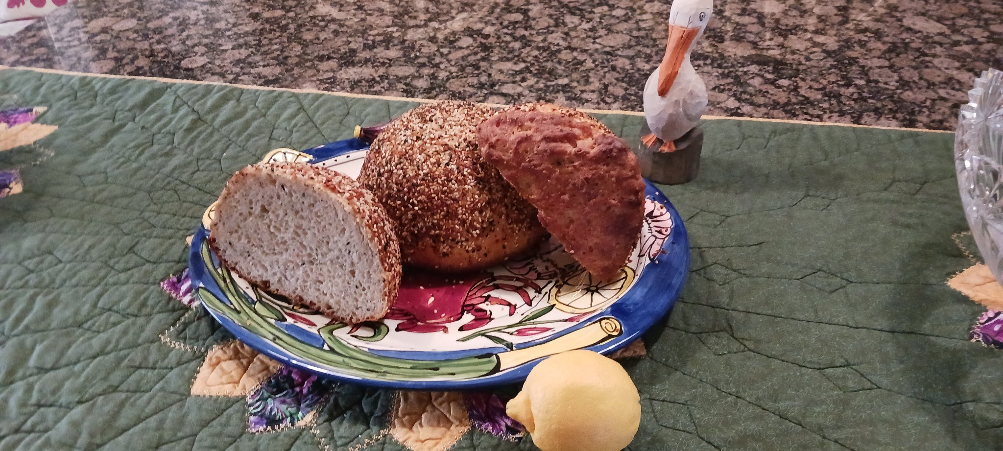 Peasant bread loaves on a hand-painted pelican plate